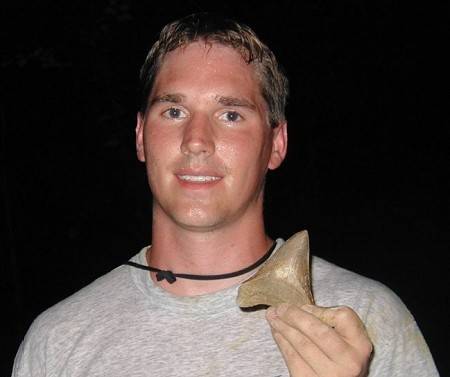 Megalodon Shark Tooth Hunting at a land site in South Carolina. It's was raining and getting dark, but it payed off!