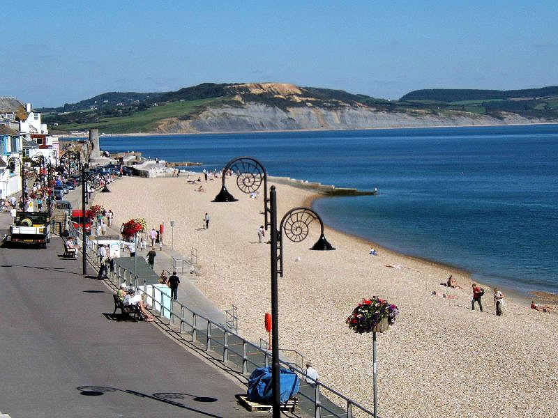 Lyme Regis, Dorset. Lyme Regis is a popular seaside town surrounded by cliffs containing the Blue Lias Formation which is a prime Jurassic fossil hunting location.  Image by Rictor Norton & David Allen (CC-by-2.0).