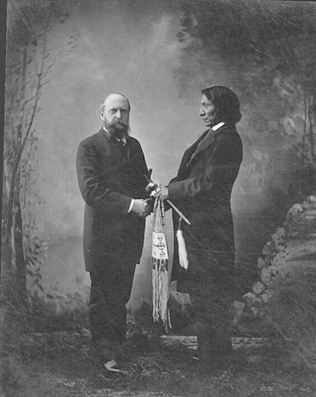 Othniel Charles Marsh with the Sioux chief Red Cloud in New Haven, Connecticut.  Red Cloud granted Marsh permission to fossil hunt in the Sioux Nation and eventually became friends.  This photo is from Red Clouds visit to Marsh's home in Connecticut. (Public Domain)