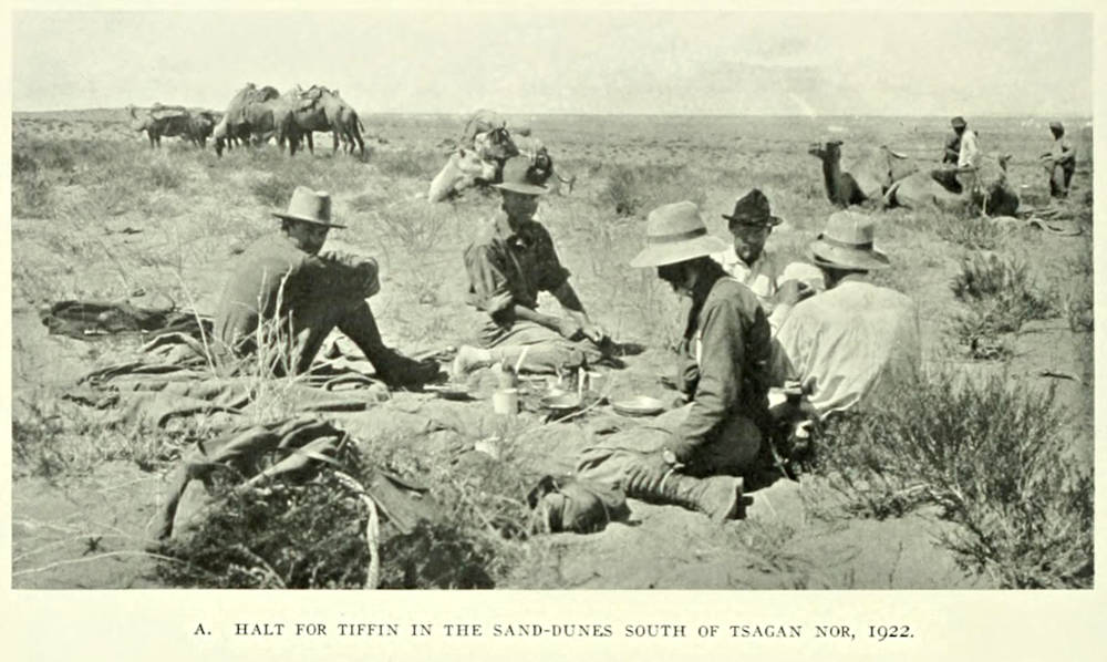 Roy Chapman Andrews and team stopping for lunch in the sand dunes.  This is the area where the famous Paraceratherium sckull (AMNH 18650) was excavated.- Plate XXXV from Andrews 1932 book (CC-BY-NC-SA 3.0).