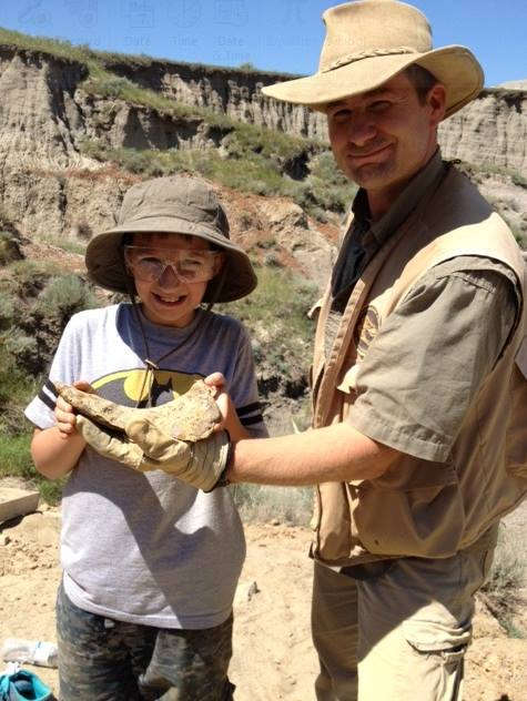 Walter W. Stein with one of his Paleoadventures dinosaur dig participants!  Perhaps he will become a future paleontologist!