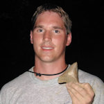 A nice 4 inch class megalodon tooth found at a land site in Coastal South Carolina