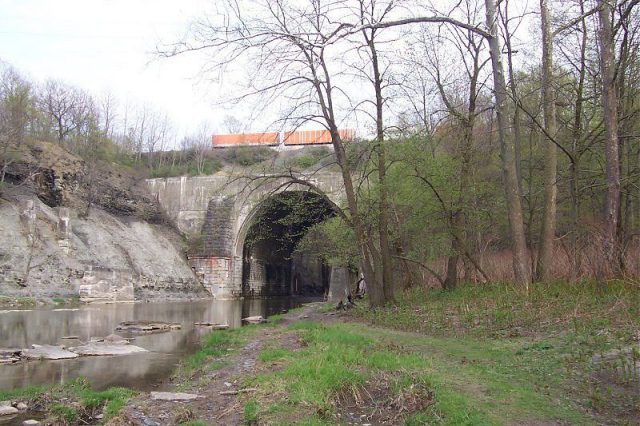 A section of 18-mile creek near a railroad bridge.