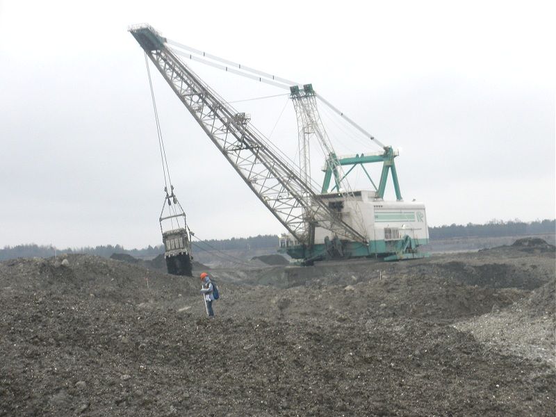 Even zoomed in, she is still dwarfed by the mine draglines.