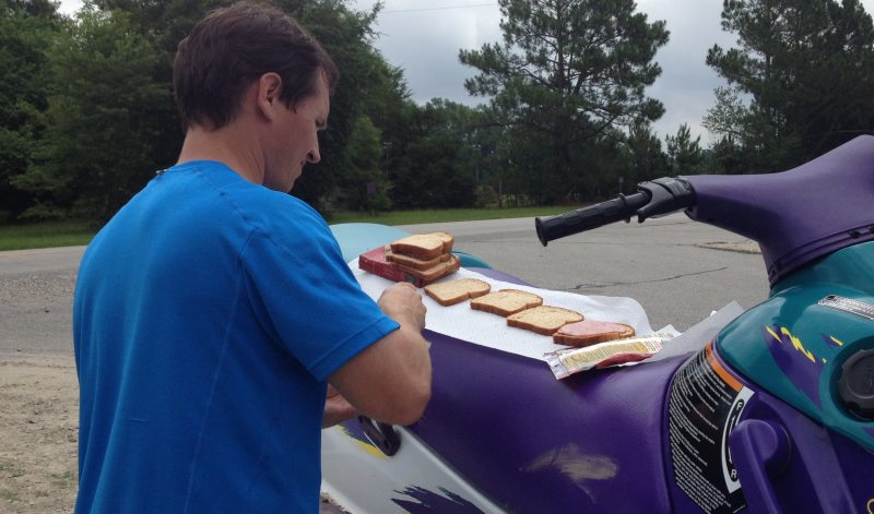 What do you do with a dead Jet Ski? Use it as a table to make sandwiches!